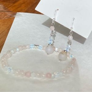 Set of lovely pink and moonstone earrings and bracelet on a silver setting.